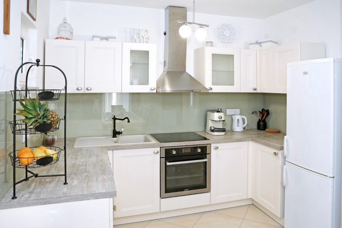Fully equipped kitchen with a coffee machine